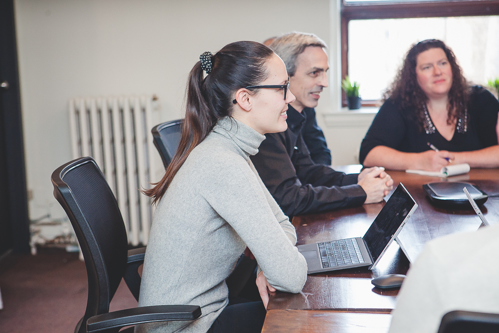 Three people in a meeting