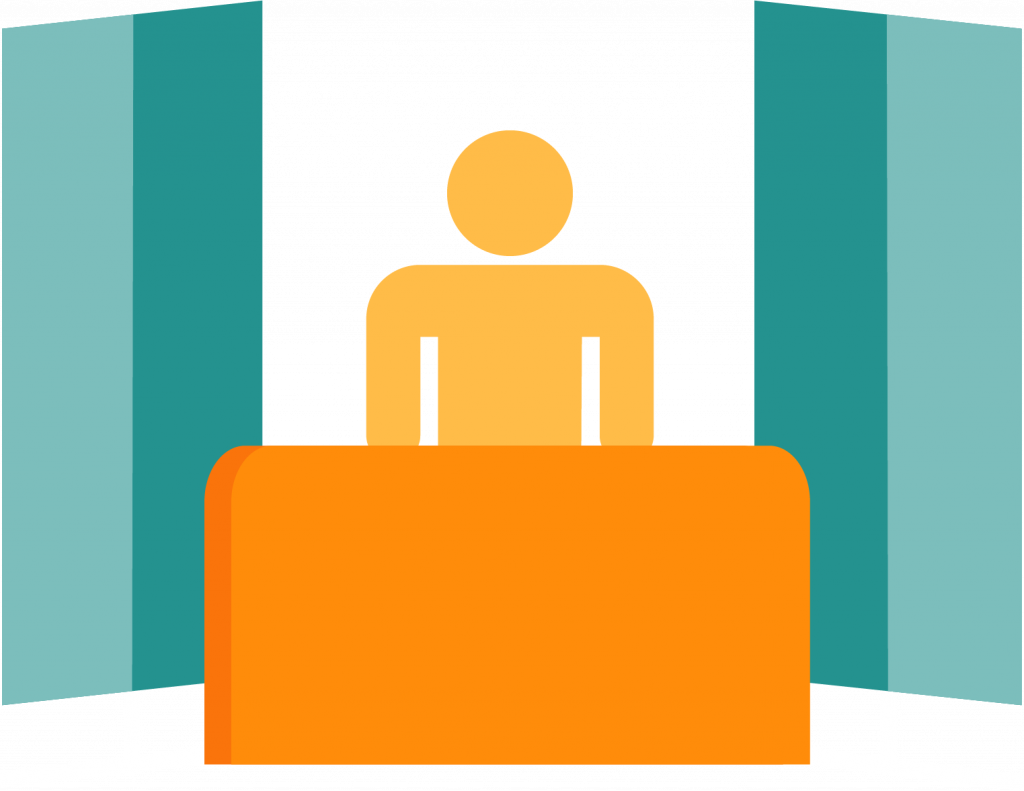 a person behind a counter during a presentation